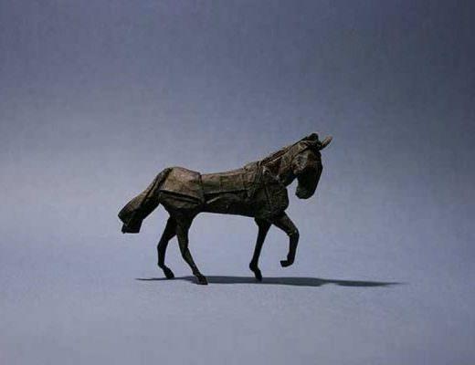 A black horse folded out of paper.