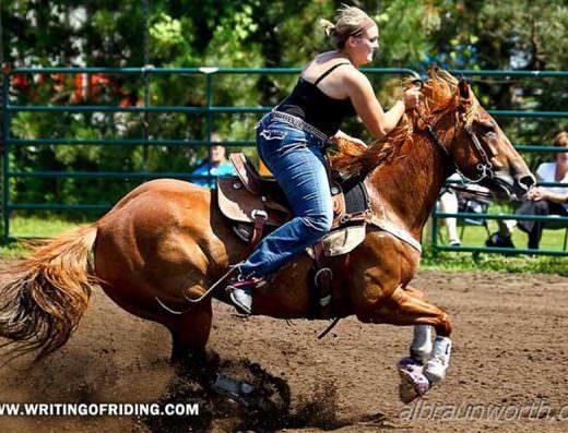 This barrel racer prefers to kick her horse directly in the flanks to drive him forwards, while also pulling hard on the curb bit.